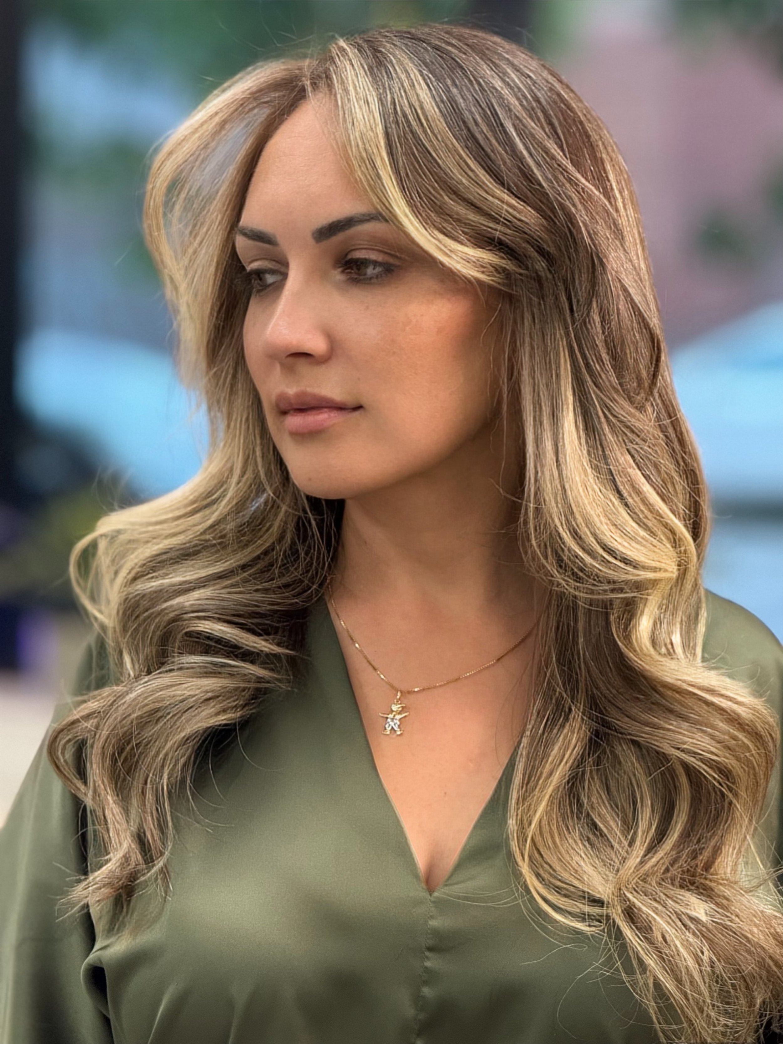 Long brunette hair with dimensional blonde face-framing highlights